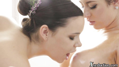 Massaging lesbian babe fingering BFF at massage table
