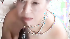 70 year old granny masturbates with a dildo that is too