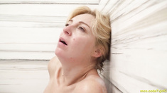The image depicts a soapy stepmother stimulating her intimate areas with her fingers.